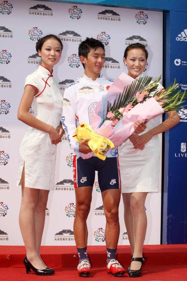 The event's best young rider collects his flowers.