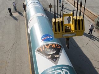 The first stage of a United Launch Alliance Delta II rocket has arrived at Space Launch Complex 17B at Cape Canaveral Air Force Station in Florida on April 7, 2011. The Delta II will be stacked at the launch pad and eventually topped by the payload fairin