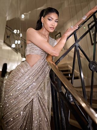 Pritika Swarup poses on a staircase at the Cannes Film Festival.