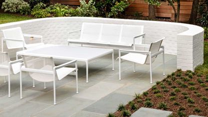 a patio with white furniture