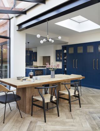 a bright house extension with a dining room and kitchen