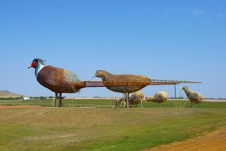 Giant pheasant statues along the Enchanted Highway in North Dakota