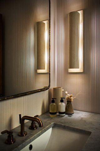 wall lights in a small powder room