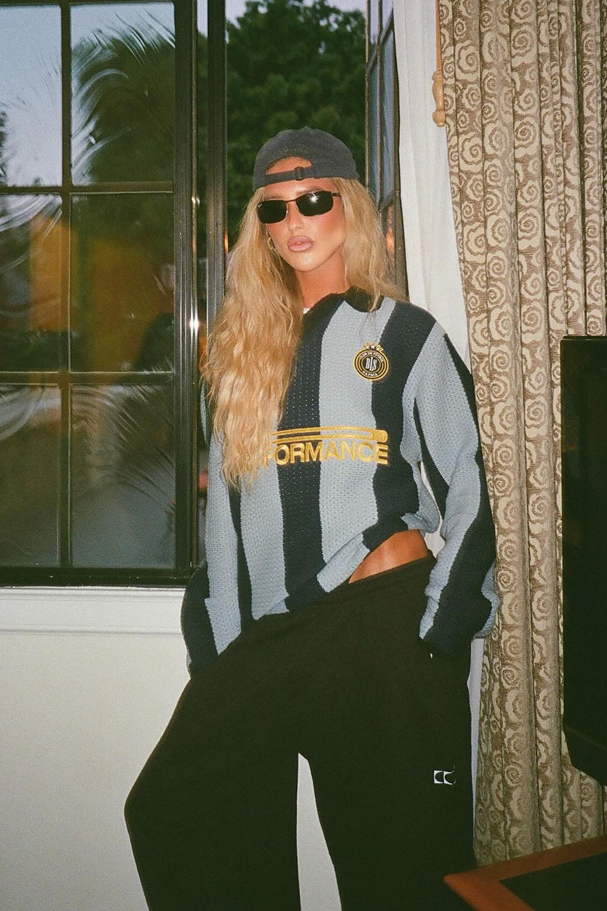 A woman wearing a knit striped jersey