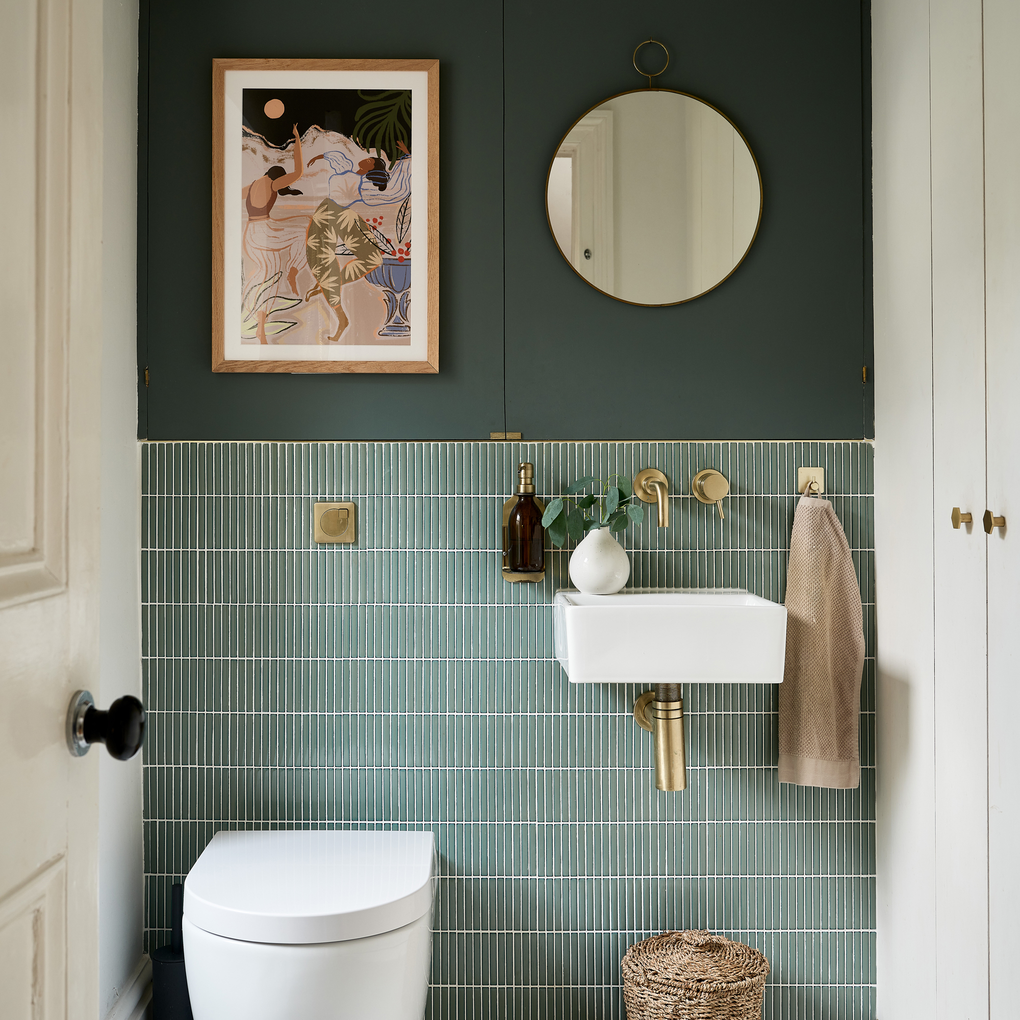 green bathroom with wall hung WC and basin tiled and painted wall