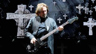 Black Sabbath’s Geezer Butler performing onstage in 2016