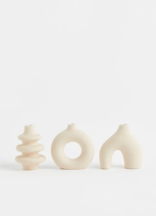 three stoneware vases in different abstract rounded shapes