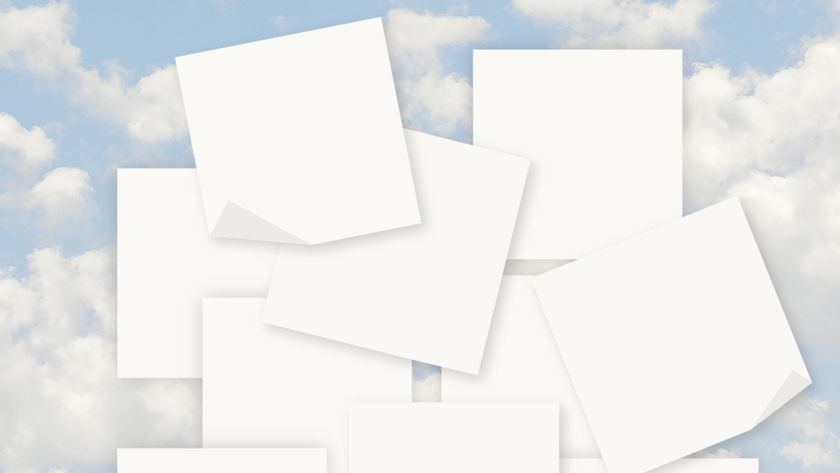 A collection of white, blank square papers scattered and overlapping against a background of a light blue sky with white, fluffy clouds.