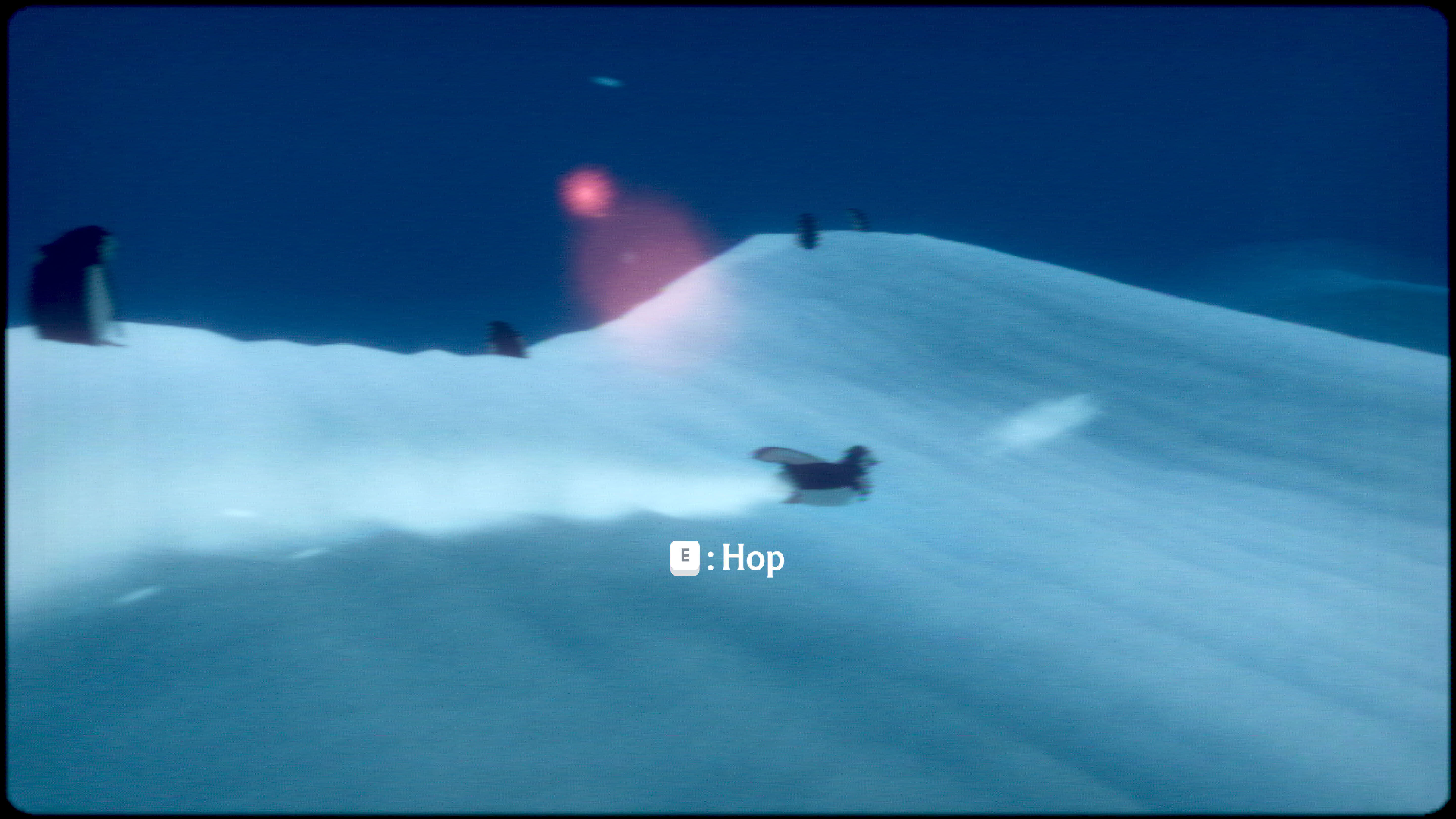 A penguin slides across antarctic snow in Penguin Colony. A button prompt informs the player that they can hop by pressing E.