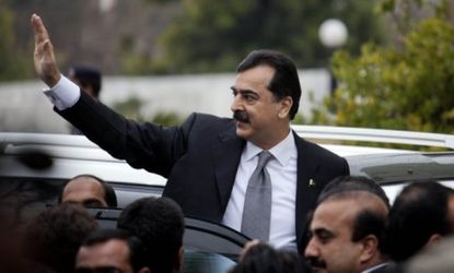 Pakistan's Prime Minister Yousuf Raza Gilani arrives at a Feb. 13 Supreme Court hearing in Islamabad: Gilani was dismissed by the court for contempt Tuesday.