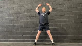 TechRadar fitness writer Harry Bullmore demonstrating a jumping jack