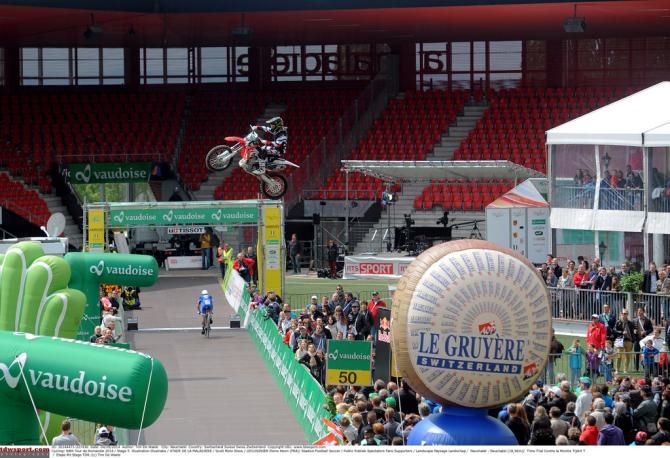 One rider in the air and another firmly on the ground