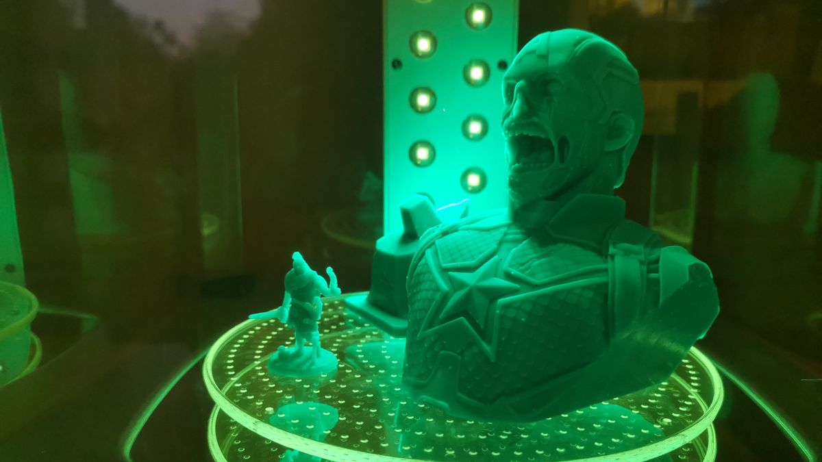 Two prints from the formlabs form 3 being cured under UV light