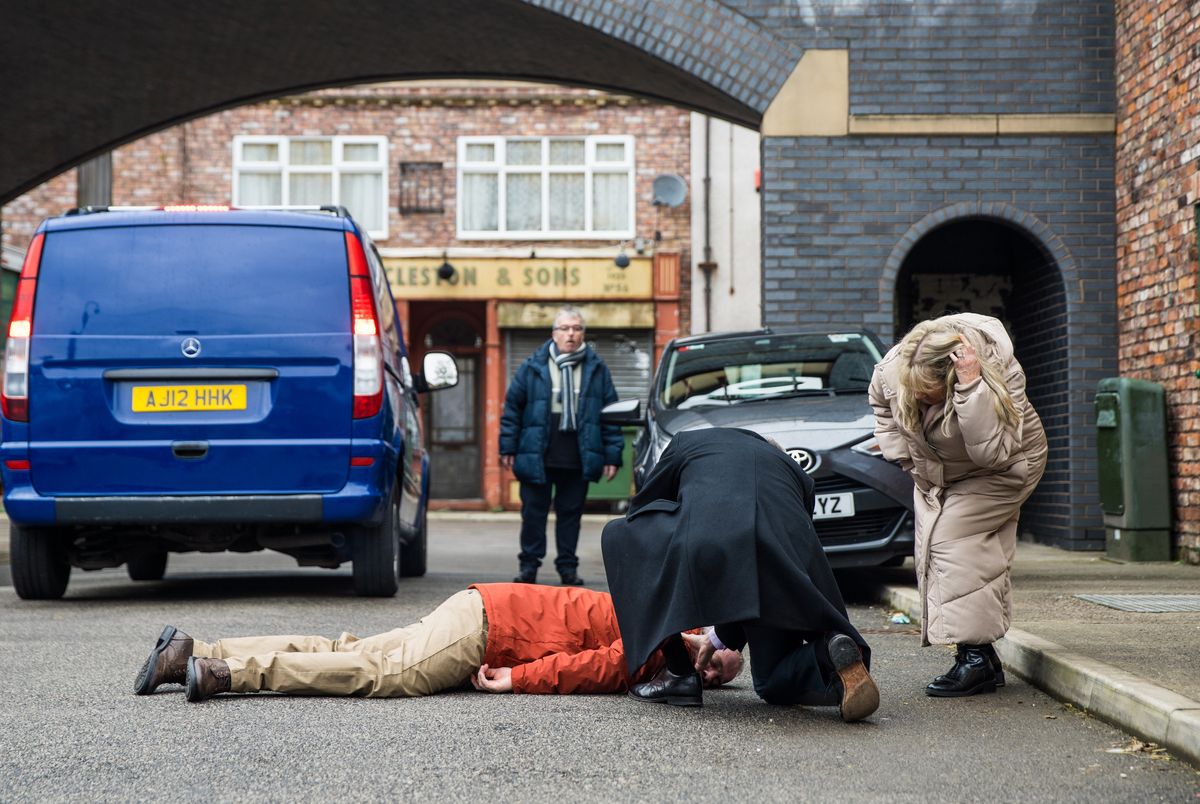 Teddy lies unconscious in the street