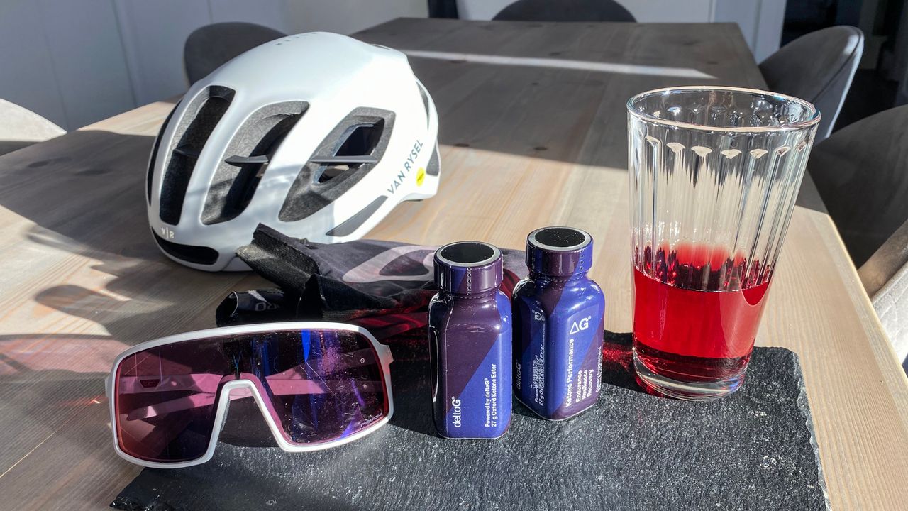 Ketone drink next to helmet and glasses on a kitchen table