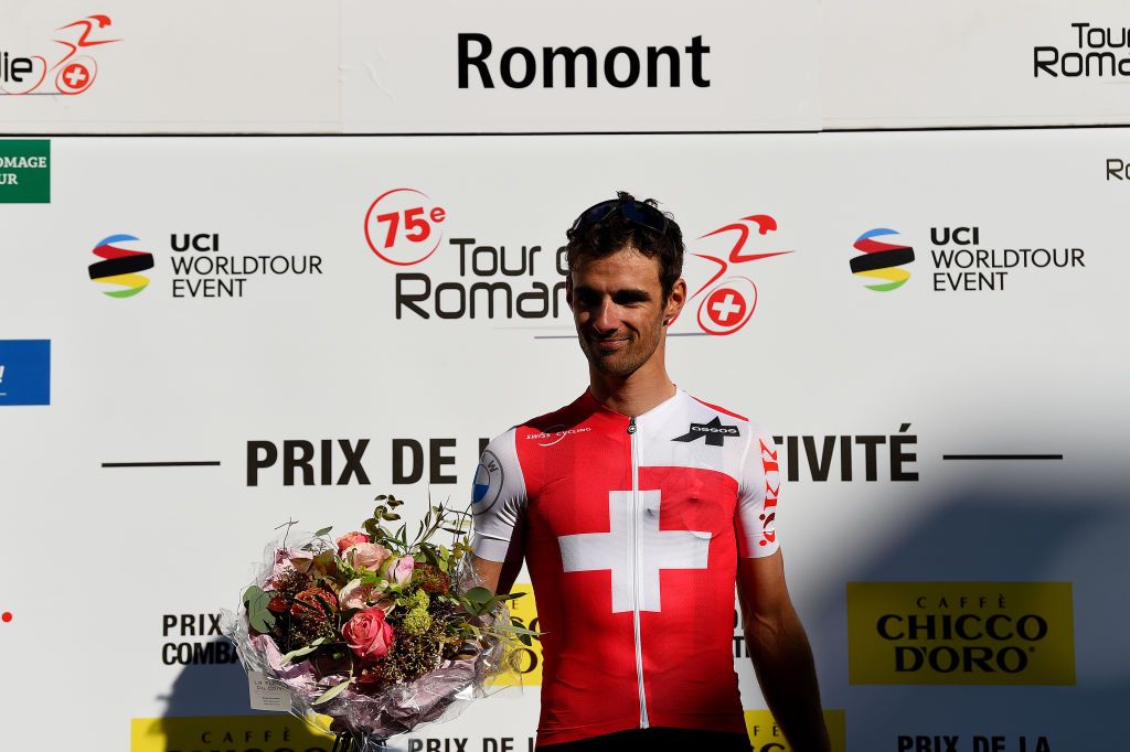 ROMONT SWITZERLAND APRIL 27 Antoine Debons of Switzerland and Team Switzerland celebrates winning the trophy for the most combative rider on the podium ceremony after the 75th Tour De Romandie 2022 Stage 1 a 178km stage from La Grande Beroche to Romont 777m TDR2022 on April 27 2022 in Romont Switzerland Photo by Dario BelingheriGetty Images