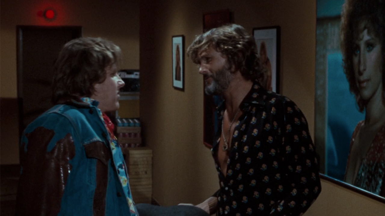 Gary Busey on the left, talking to Kris Kristofferson in A Star is Born