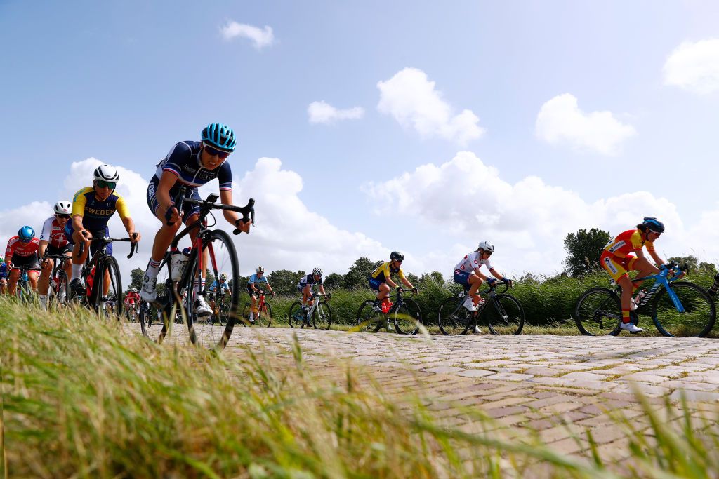 The riders used the smooth strips to the sides of the cobblestones