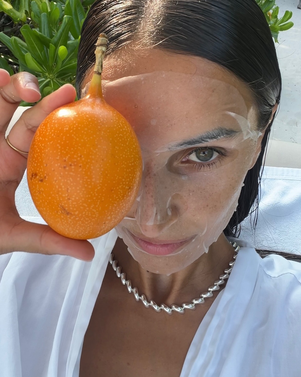 An image of a woman wearing a sheet mask.