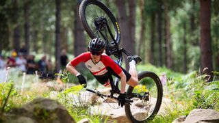 Emily Bridson of Team Jersey crashes during the Women's Cross-country Final on day six of the Birmingham 2022 Commonwealth Games at Cannock Chase