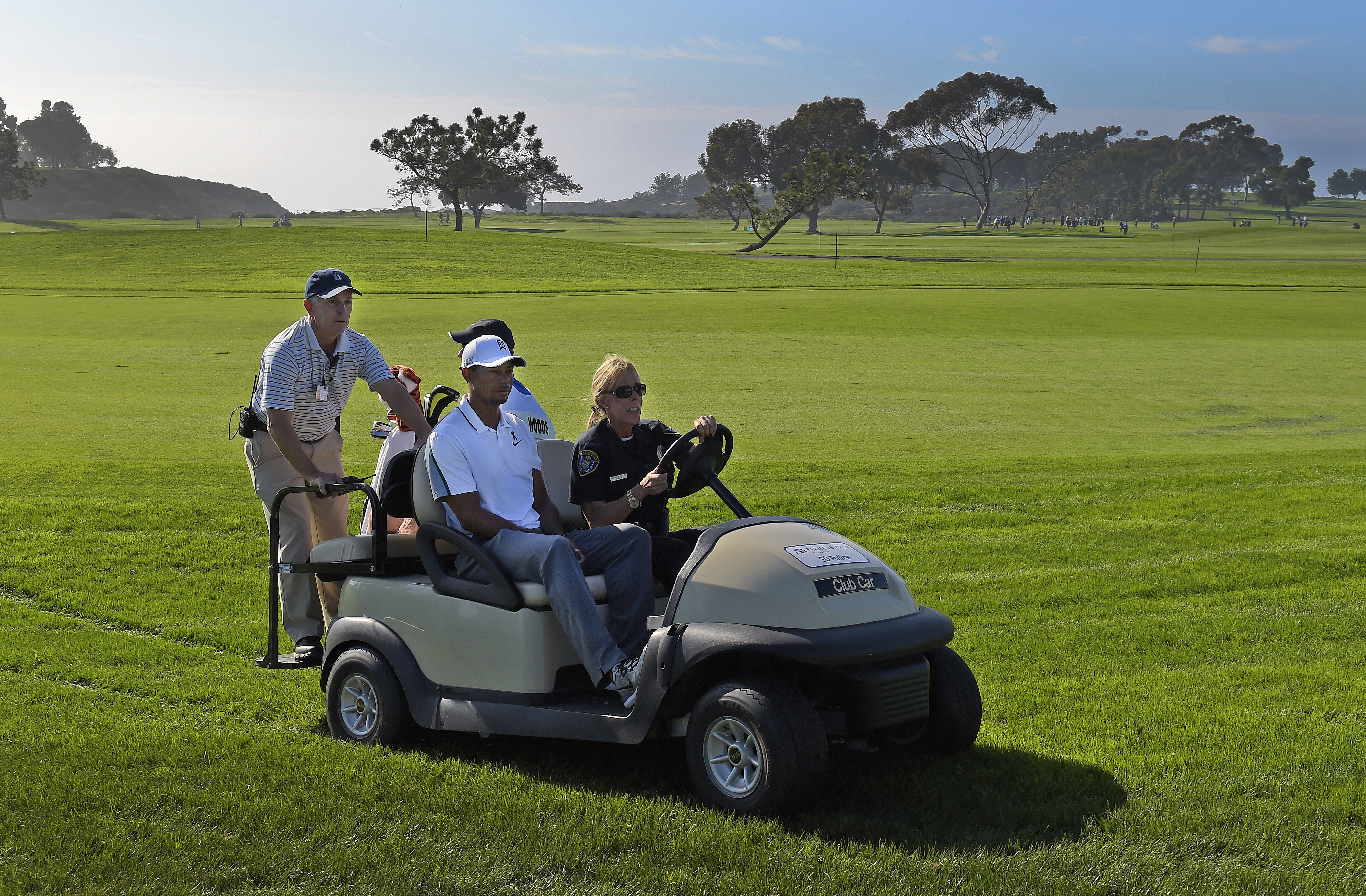 Tiger Woods leaves the course following WD at Farmers Open. He would miss the Masters