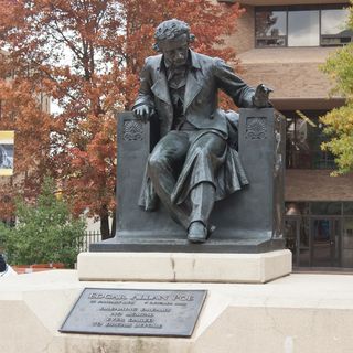 Statue of Edgar Allan Poe in front of the University of Baltimore School of Law.