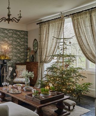 Traditional living room with Christmas tree and antique furniture