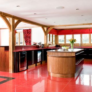 red kitchen with red long curtain and flower vase