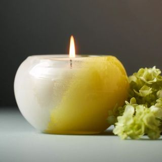 Round candle with green and clear glass