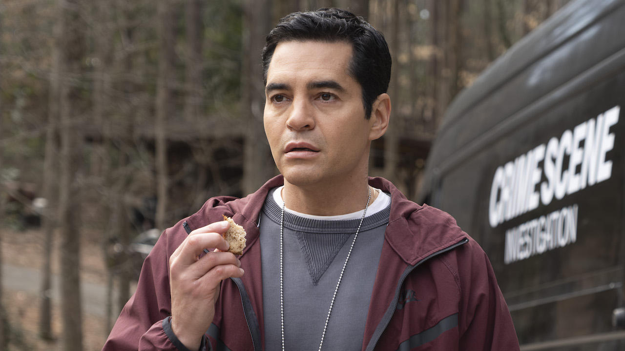 Will shocked standing outside crime scene van holding a piece of bread in Will Trent Season 3