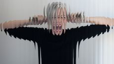 Close up of a fragmented woman screaming through reed glass