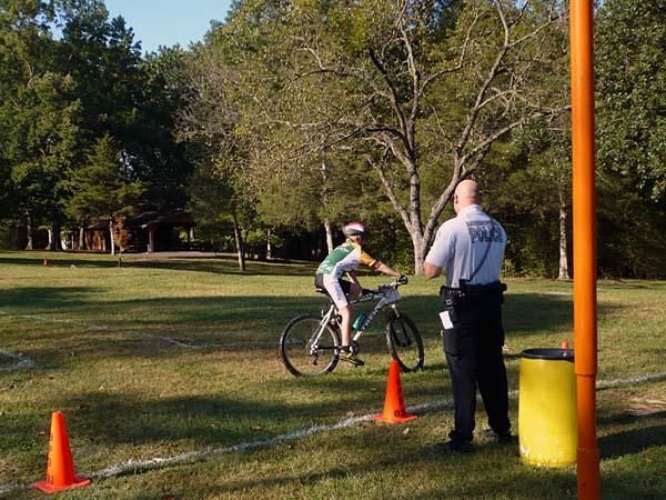 A Harrisonburg City Police officer teaches bike safety.