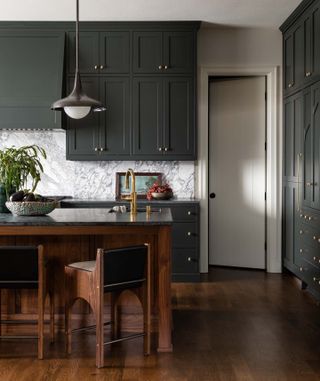 grey kitchen cabinets with marble backsplash by Heidi Caillier Design