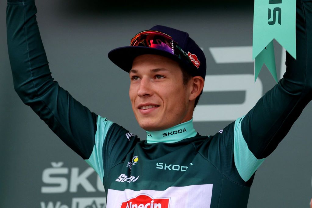 Alpecin-Deceuninck's Belgian rider Jasper Philipsen celebrates on the podium with the best sprinter's green jersey after the 16th stage of the 110th edition of the Tour de France cycling race, 22 km individual time trial between Passy and Combloux, in the French Alps, on July 18, 2023. (Photo by Thomas SAMSON / AFP)