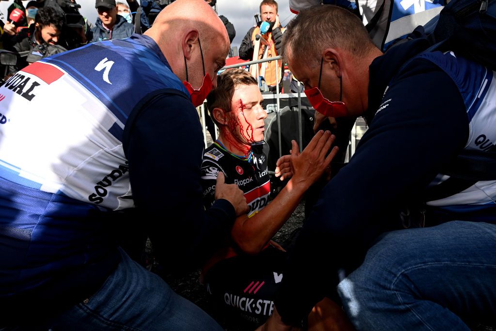ARINSAL SPAIN AUGUST 28 Remco Evenepoel of Belgium and Team Soudal Quick Step injured after winning the stage and colliding with medic Raquel Ortolano of Spains Team Astana Qazaqstan during the 78th Tour of Spain 2023 Stage 3 a 1585km stage from Sria to Arinsal 1911m UCIWT on August 28 2023 in Arinsal Andorra Photo by Tim de WaeleGetty Images