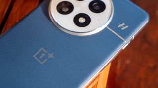 A close-up of the textured vegan leather on the back of the Ocean blue OnePlus 13