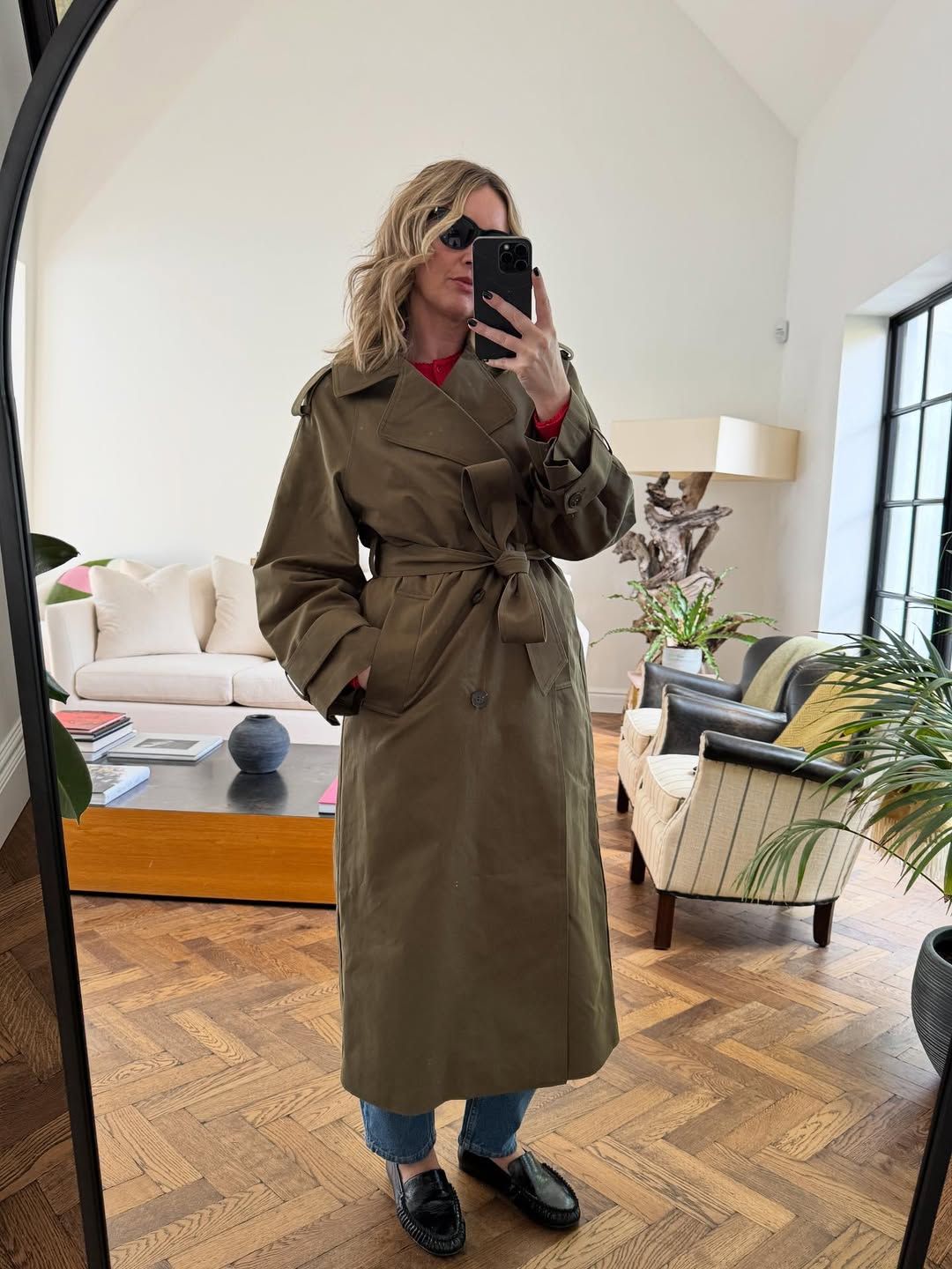 Emma Rose Thatcher wearing the khaki Nobody's Child trench coat