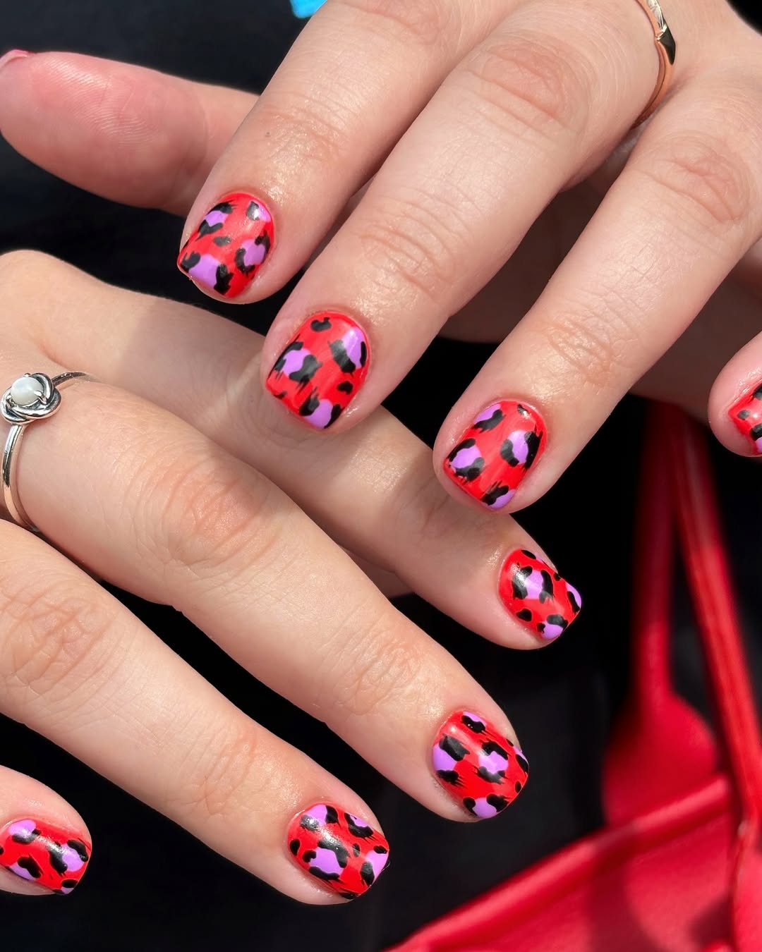 red and pink leopard nails