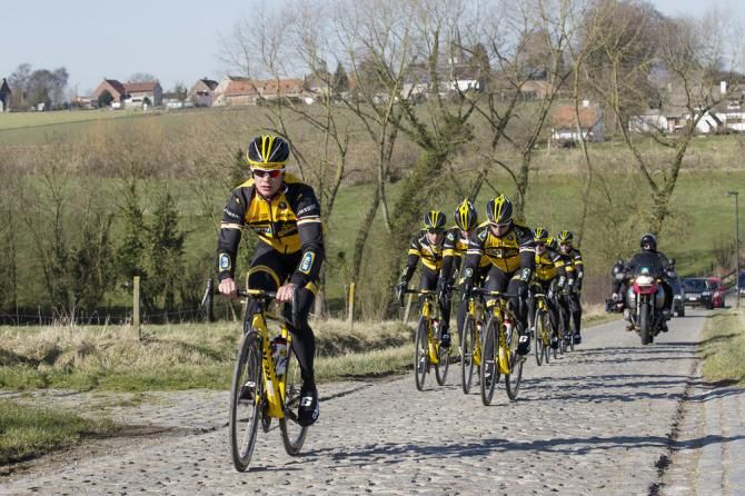 MTN-Qhubeka team members ride the Haaghoek sector of cobbles.