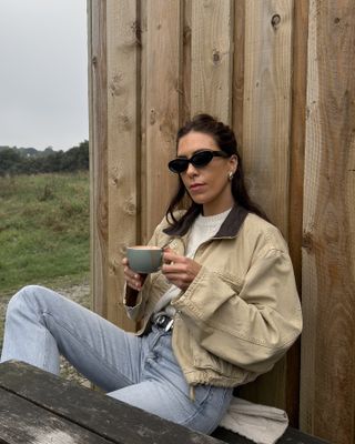 woman in barn jacket and jeans