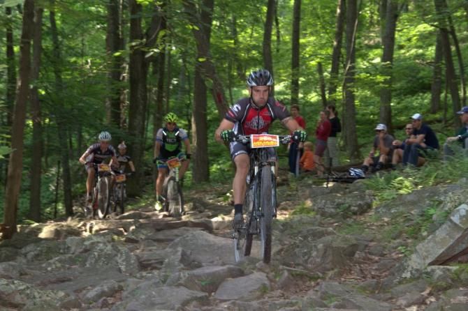 Local rider Matthew Patrararca (The Bicycle Shop) shows everyone how to ride the rocks after 3 Bridges