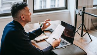 Man studying online at home