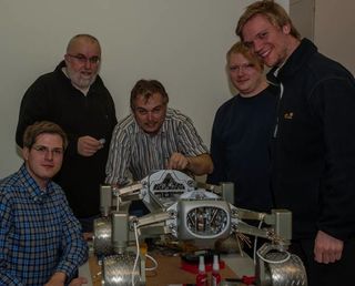 Several of the Part-Time Scientists and the rover.
