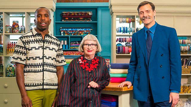 &quot;Great British Sewing Bee&quot; host Kiell Smith-Bynoe alongside judges Esme Young and Patrick Grant in a promotional image for season 10