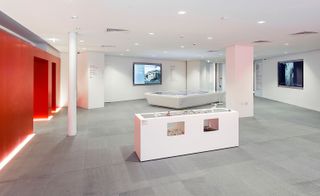 An image showing a multiple screens in the welcoming space on the first floor