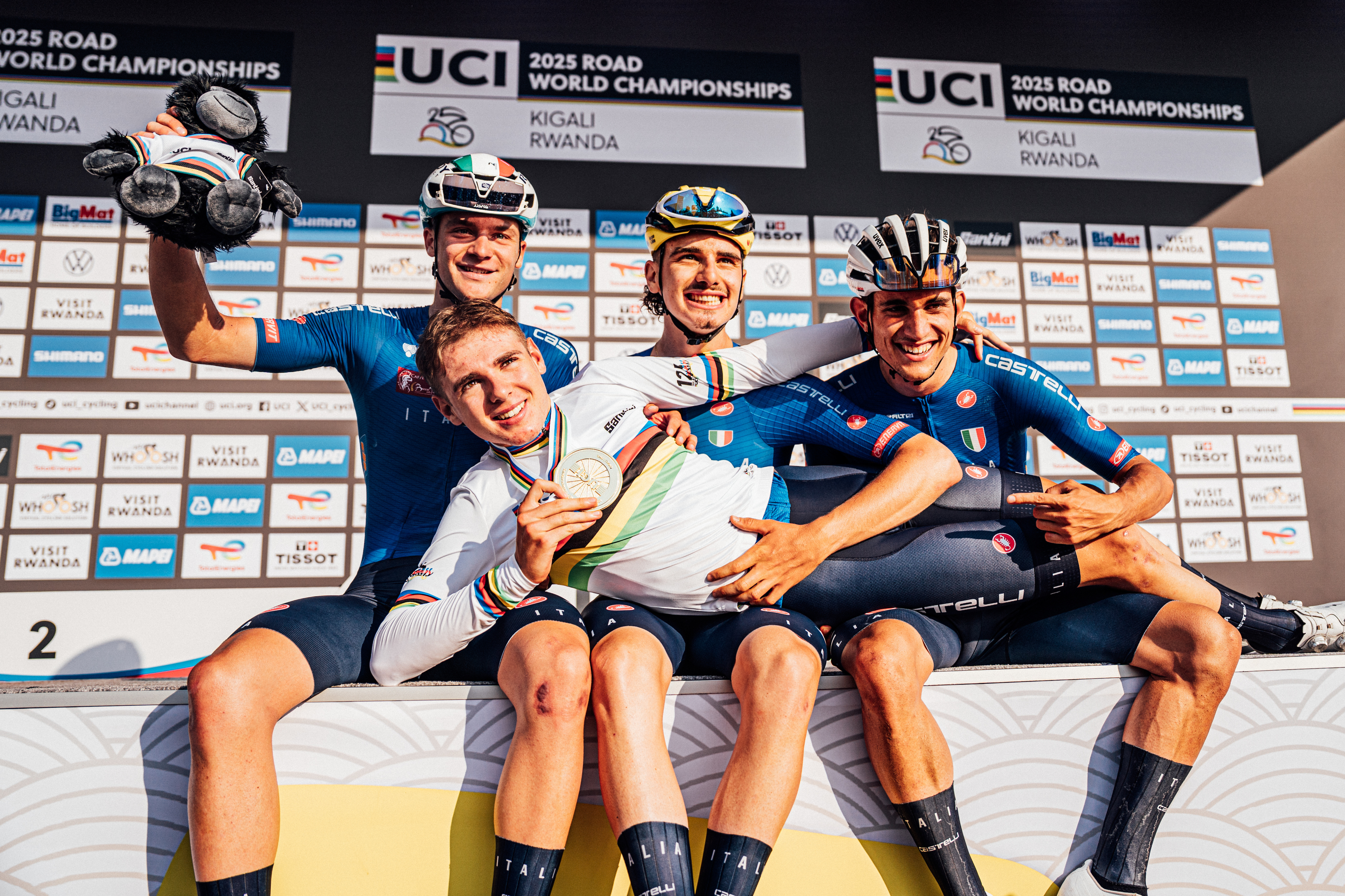 Cycling - 2025 UCI Road World Championships - Kigali Convention Centre, Kigali, Rwanda - Men Under-23 Road Race Podium - Lorenzo Mark Finn (Italy) celebrates with teammates Alessandro Borgo (Italy), Simone Gualdi (Italy), Pietro Mattio (Italy) after he Wins the Men Under-23 Road Race World Championship