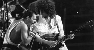 A black-and-white image of Brian May and Freddie Mercury onstage