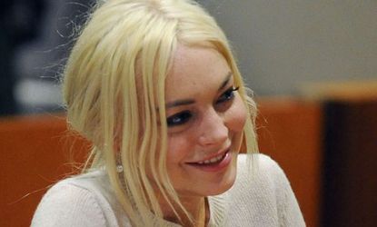 Lindsay Lohan smiles during her probation hearing last month: The troubled star is reportedly in talks to play the late Elizabeth Taylor.
