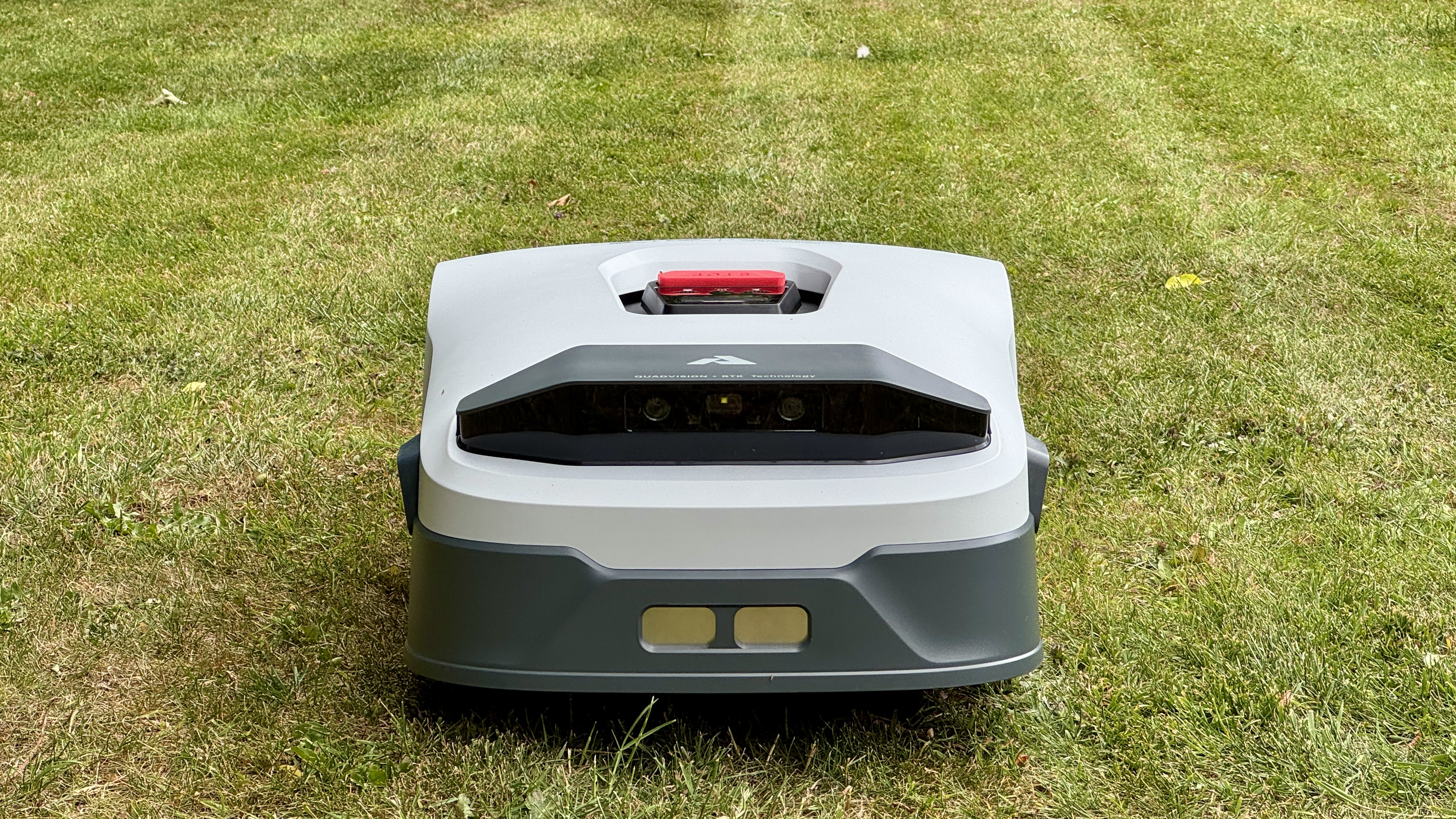 Anthbot Genie 300 robot lawn mower in reviewer's yard