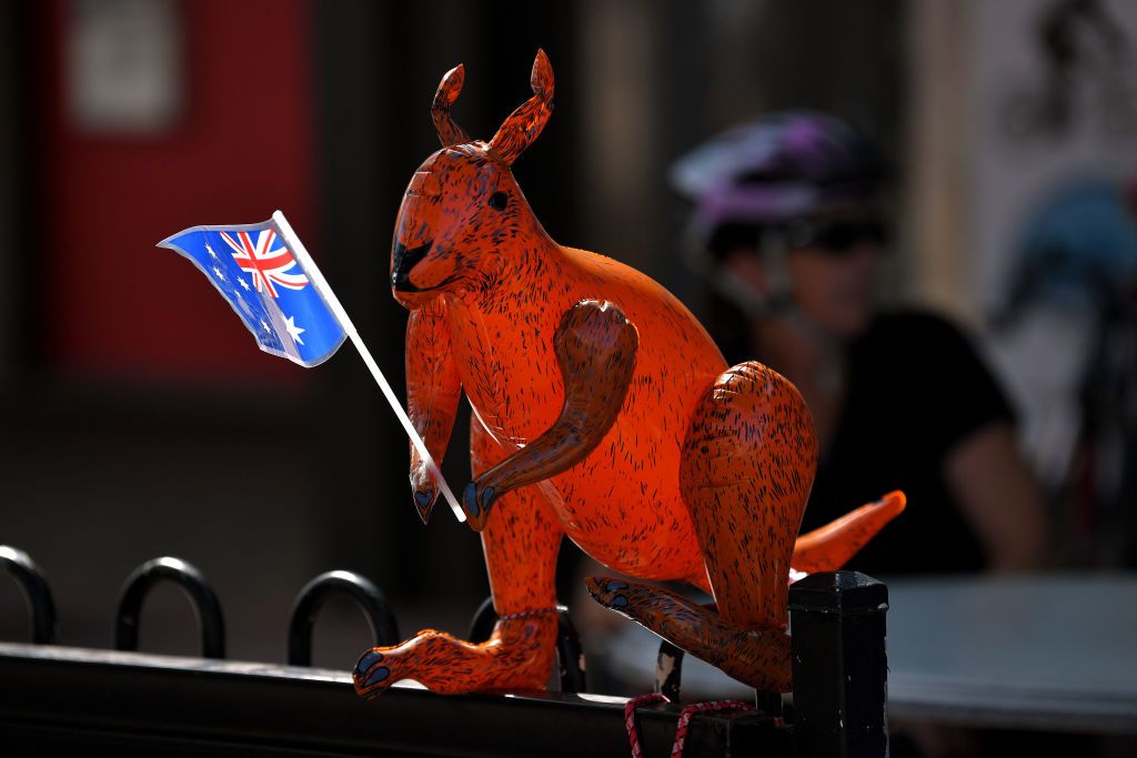 A kangaroo waves the Australia flag